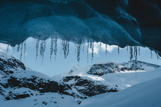 View of majestic glacier with frozen icicles and snow-covered mountains, Morteratsch, Graubunden, Switzerland.