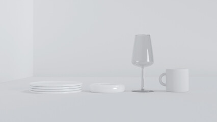 Glass cup and white plates stand on a white background