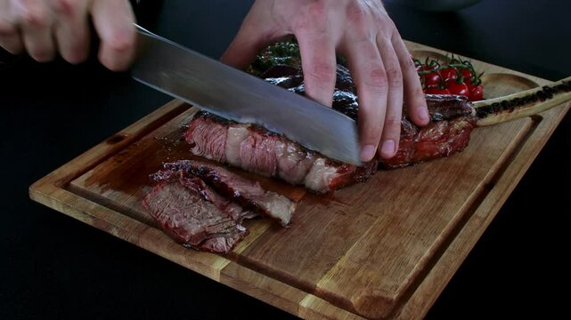 A close-up scene of a skilled chef slicing a juicy, grilled tomahawk steak on a wooden cutting board, capturing the savory texture and rich flavors of the meat. The steak, perfectly cooked with a char