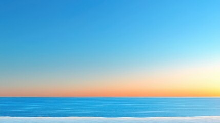 Obraz premium Serene ocean view at sunset with a clear blue sky