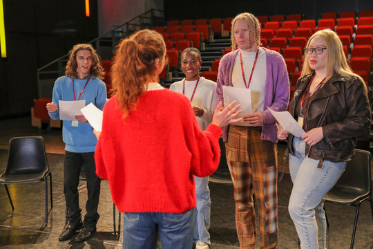 Persons with disabilities holding script