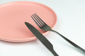 Empty plate with knife and fork