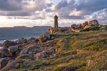 The Ploumanach Lighthouse officially the Mean Ruz Lighthouse located on a cape of pink granite rock...