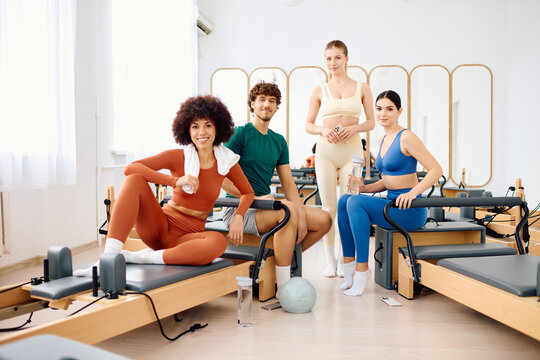 Enjoying a rejuvenating group pilates session in a bright and inviting studio environment