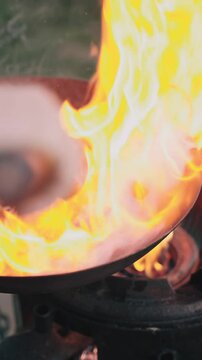 Minced beef meat called cevapi or cevapcici grilled in pan with fire