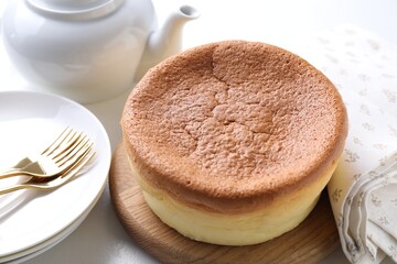 Tasty Japanese Castella sponge cake on white table, closeup