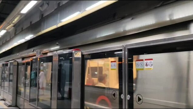 New Delhi, India, August 12 2024 - Delhi Metro train arriving at Jhandewalan metro station in New Delhi, India, Asia, Public Metro departing from Jhandewalan station