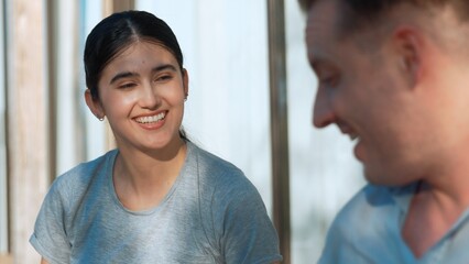 Lovely middle age marriage couple romantically talk about good event or news at outdoor terrace relax and chat. Cheerful father and mother have happy relationship and strong family bond. Divergence.