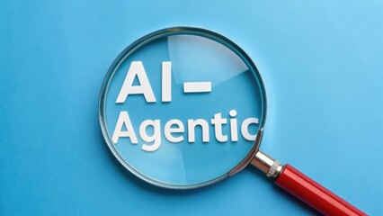 AI Agentic. Magnifying glass focusing on the text "AI - Agentic" against a blue background.