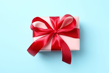 Beautiful gift box on color background