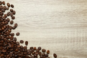 Fresh coffee beans on wooden background