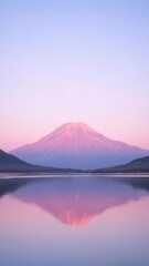  A Serene Pink Mountain at Sunrise with Soft Lavender Hues in the Sky and Reflective Waters Below