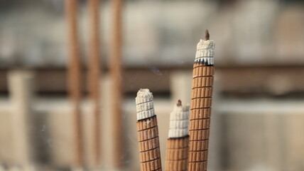 Close-up of Burning Incense Sticks at a Temple – Spiritual Offering and Prayer
