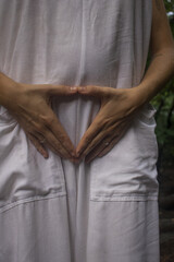 Woman connecting to mother earth and her feminine energy