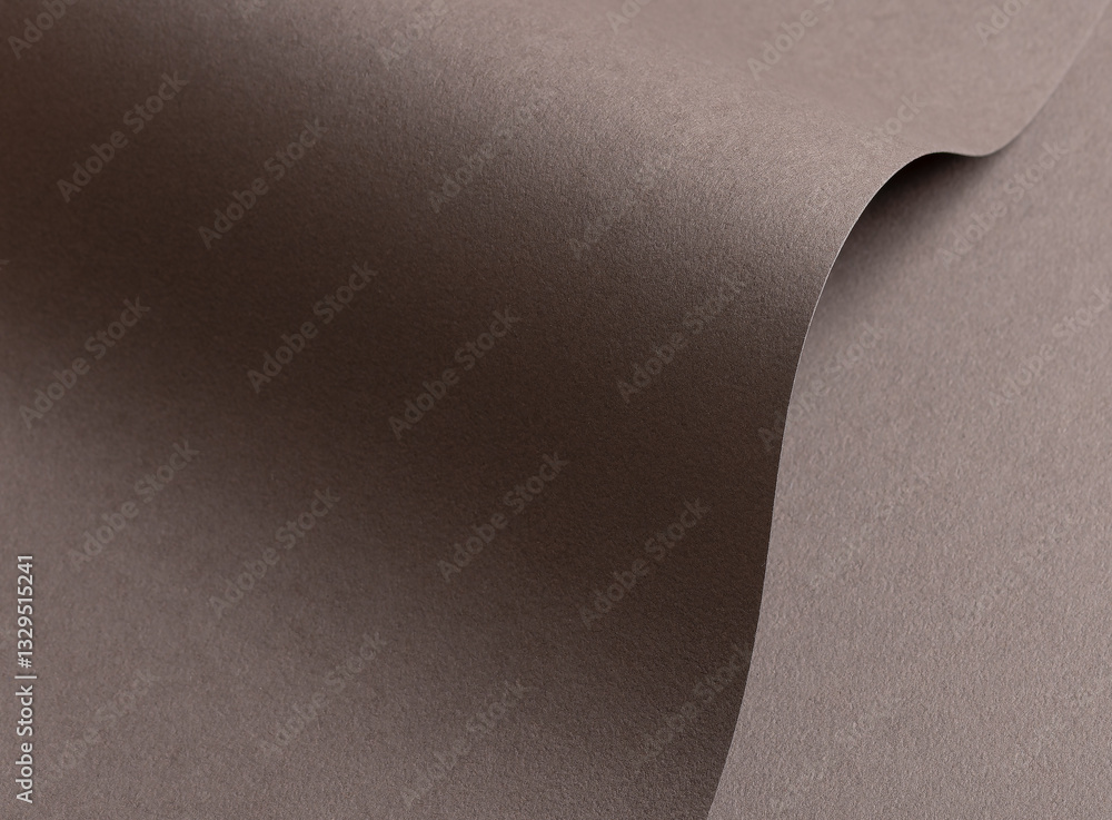 Poster mocha mousse paper background with a matte, grainy texture and curved, wavy edges. rich neutral tone