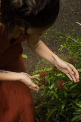 Woman connecting to mother earth and her feminine energy