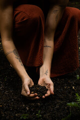 Woman connecting to mother earth and her feminine energy