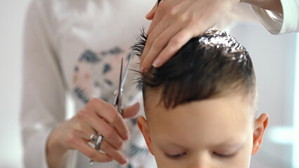 Cute little boy at home getting his haircut. Time for a Haircut
