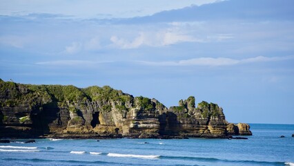 Dramatic aerial rocky ocean coastline vista of New Zealand Punakaiki Pancake Rocks