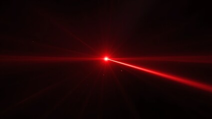 Obraz premium A vivid red laser beam illuminates the darkness, creating a captivating visual effect in a technology-focused setting.