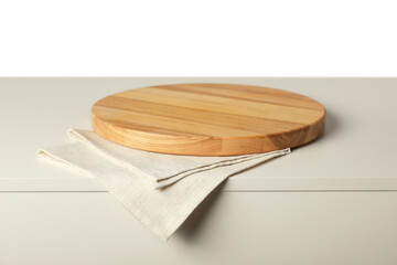 Napkin and empty wooden board on light table against white background