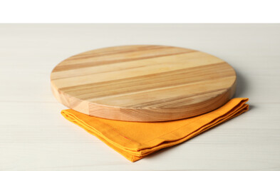 Orange napkin and empty board on light wooden table against white background