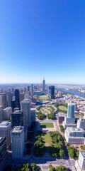 Obraz premium A breathtaking drone view of a sprawling cityscape, with skyscrapers, busy streets, and vibrant green parks under a bright blue