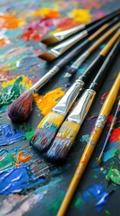 Fototapeta premium Vibrant Artist Paintbrushes on Colorful Palette