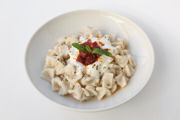 Mantı - Turkish ravioli pasta on white background