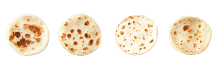 Multiple tortillas are arranged in a row, displaying various levels of toasting and cooking. Each tortilla has unique markings, highlighting textures and colors from the cooking process
