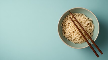 Fototapeta premium Instant noodle bowl with chopsticks minimalist kitchen food photography bright color top view culinary delight