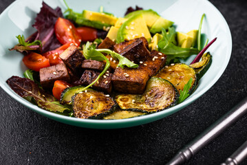 Healthy vegan keto salad with tofu and avocado