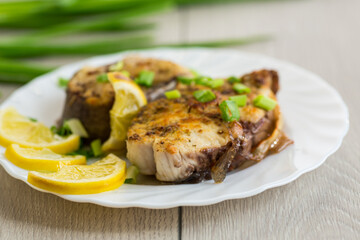 Baked fish with lemon and herbs