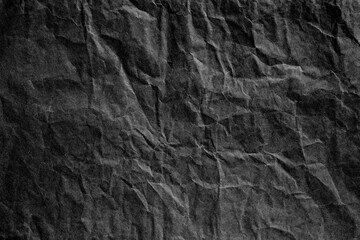 Black crumpled paper material texture