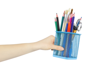 Colored pencils and various school supplies in a metal holder or cup in hand, outstretched hand with pen stand isolated from background