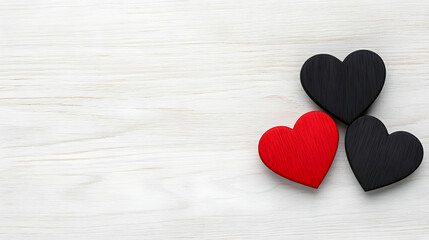 Fototapeta premium Red and black hearts on a white wooden background
