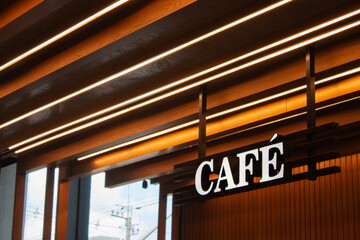 Modern Cafe Sign with Warm Linear Lighting