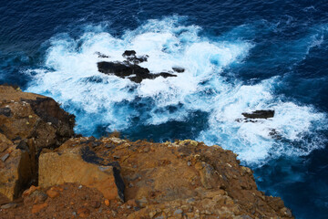 foamy water of the Atlantic Ocean under the cliffs of the  Ponta de São Lourenço (Madeira, Portugal)