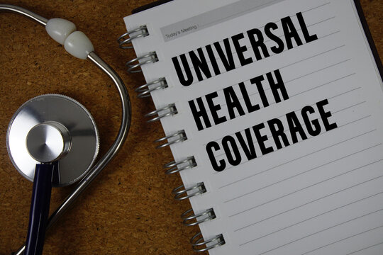 Universal Health Coverage (UHC) text on paper with stethoscope flat lay on cork board background