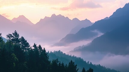 Fototapeta premium A breathtaking mountain view with misty peaks at sunrise.
