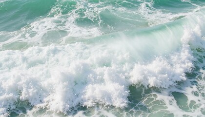 Fototapeta na wymiar Close-up of ocean waves crashing with foamy white water in turquoise sea.