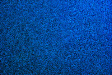 Fototapeta premium Blue textured paint or plaster background and texture