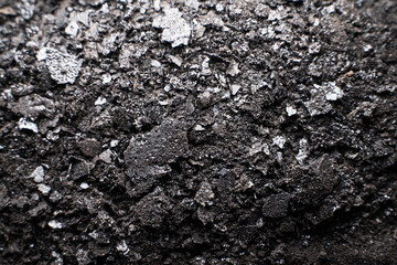 Soot from a chimney, close-up. Cleaning the chimney after the heating season in winter
