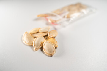 Zucchini seeds close-up on a white background