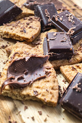 Detail of diced chocolate with shavings and crushed cookies.