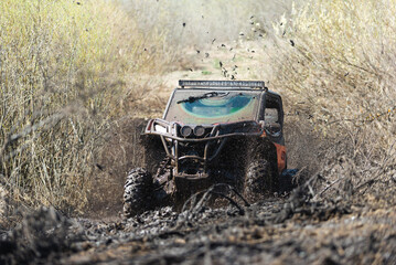 Off-road buggy overcomes water obstacle. Image of off-road adventures. © yallowww