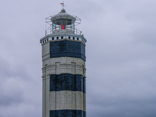 A coastal lighthouse, which is used to mark the shores and determine the location of the vessel. A coastal landmark. A lighthouse located in Anapa, Russia, on the shores of the Black Sea.