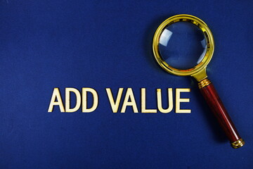 Add Value alphabet letters with magnifying glass on navy blue background