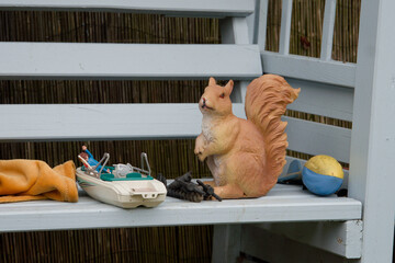 Plastic decoy squirrel and toys