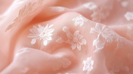 Fototapeta premium Peach chiffon fabric with delicate floral embroidery. Ideal for fashion, textile, and background designs.